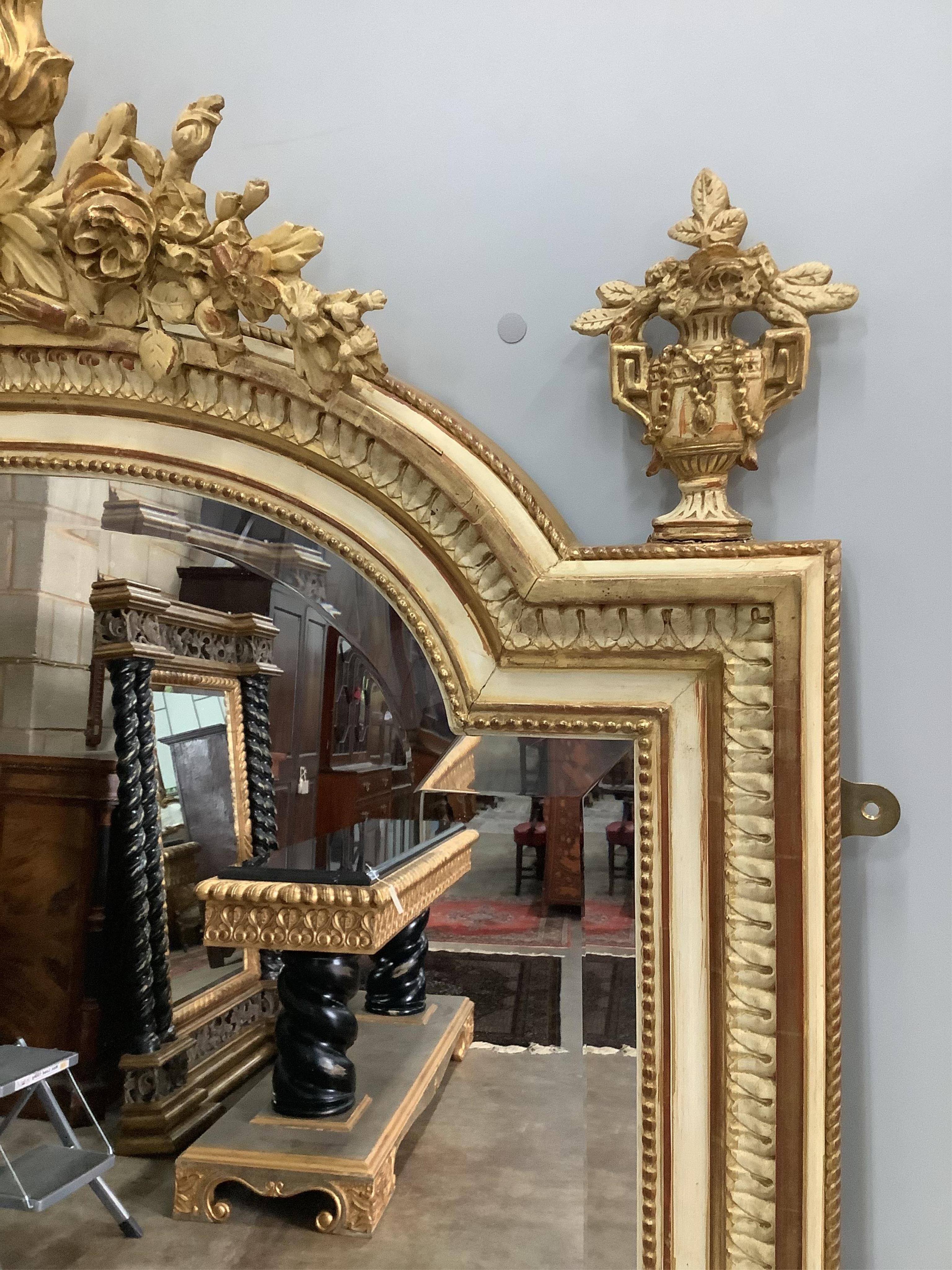 A French parcel gilt cream painted wall mirror, width 108cm, height 160cm. Condition - good